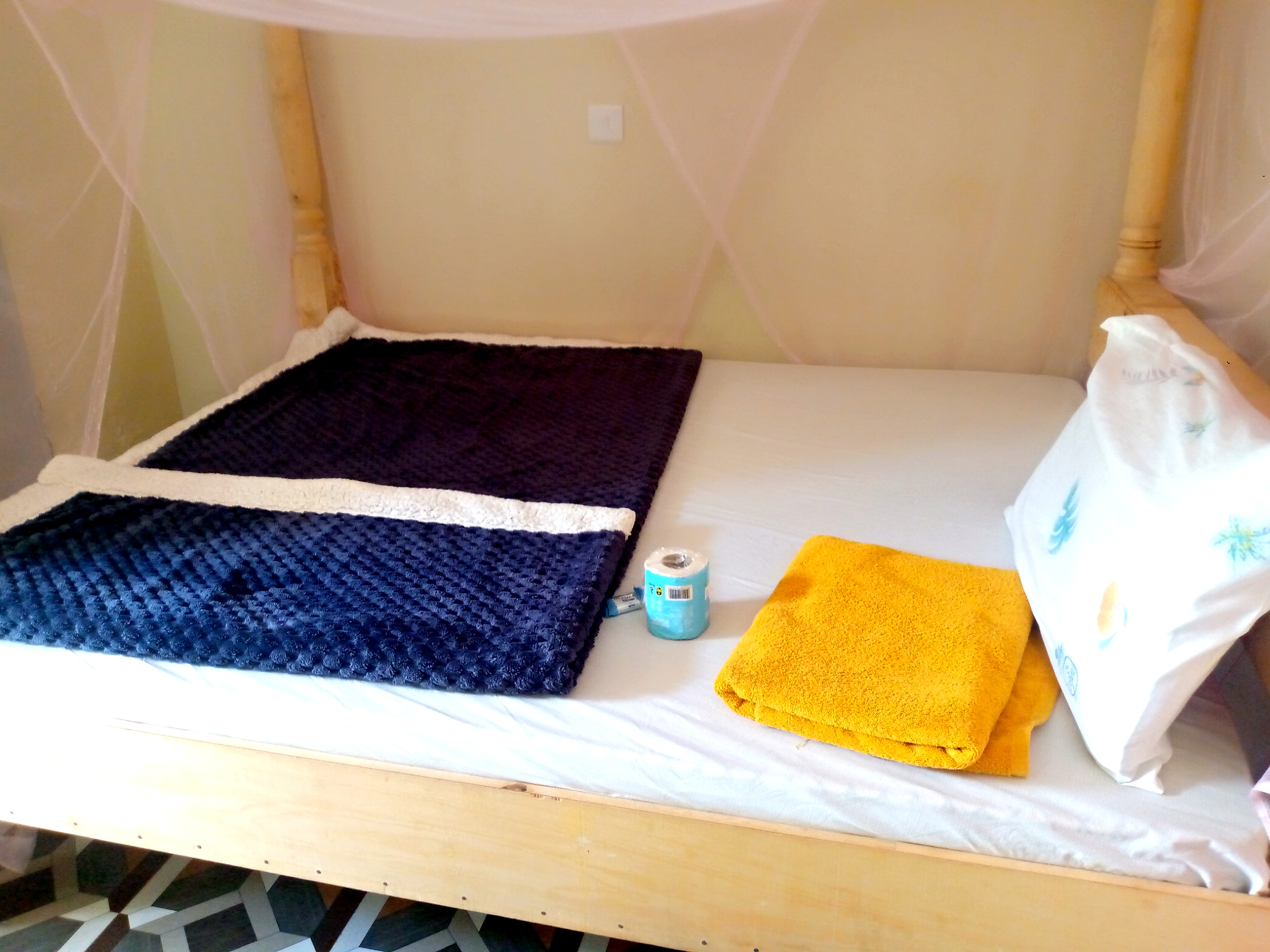 Trattoria lodge bedroom prepared for guests